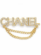 CHANEL Gold and Clear Crystal Draped Chain Brooch - Sable & Red