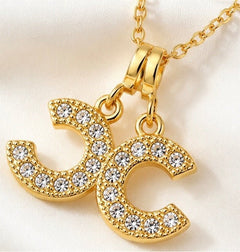 Gold Double CC Crystal Pendant Necklace 18” Chain - Sable & Red